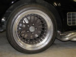 A close up shot of the new front rotor and caliper