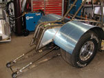 Side view of wheelie bars and trimmed tubs