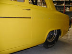 Buttons riveted on and front trim piece on the Anglia