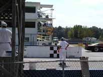 The car is a blur as it crosses the Finish line