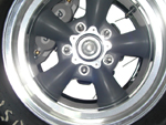 A close-up of the brakes with the wheel