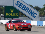 The Ferrari on the front straight